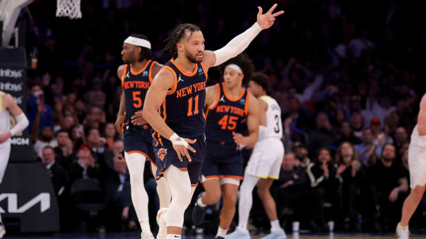 New York Knicks guard Jalen Brunson (11) celebrates his three point shot against the Utah Jazz during the third quarter at Madison Square Garden in New York City on Jan. 30, 2024.